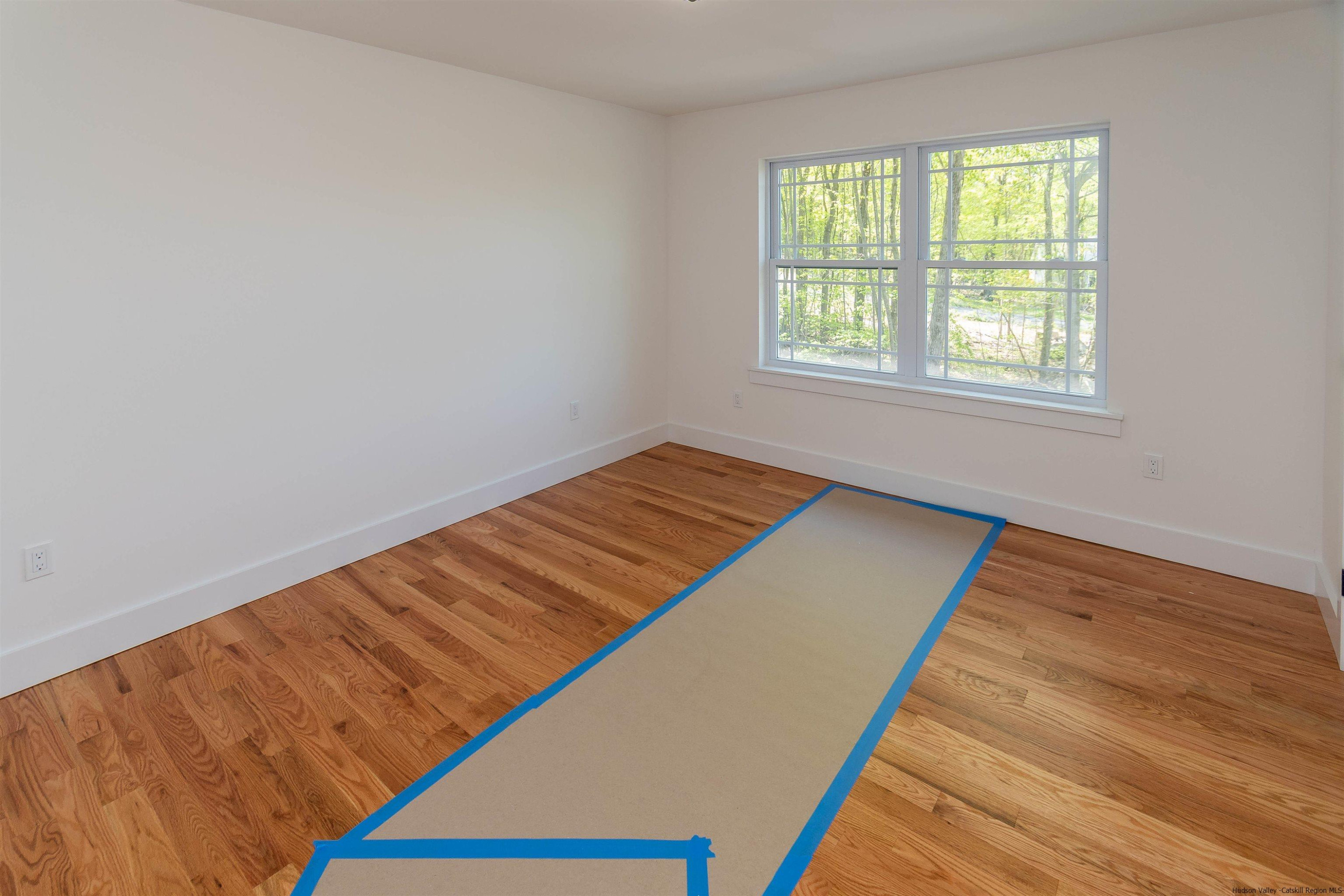 5 Calico Ways Ways, Unit WAYS Wallkill, NY 12589 - Photo 22 of 35 a view of a room with wooden floor and window