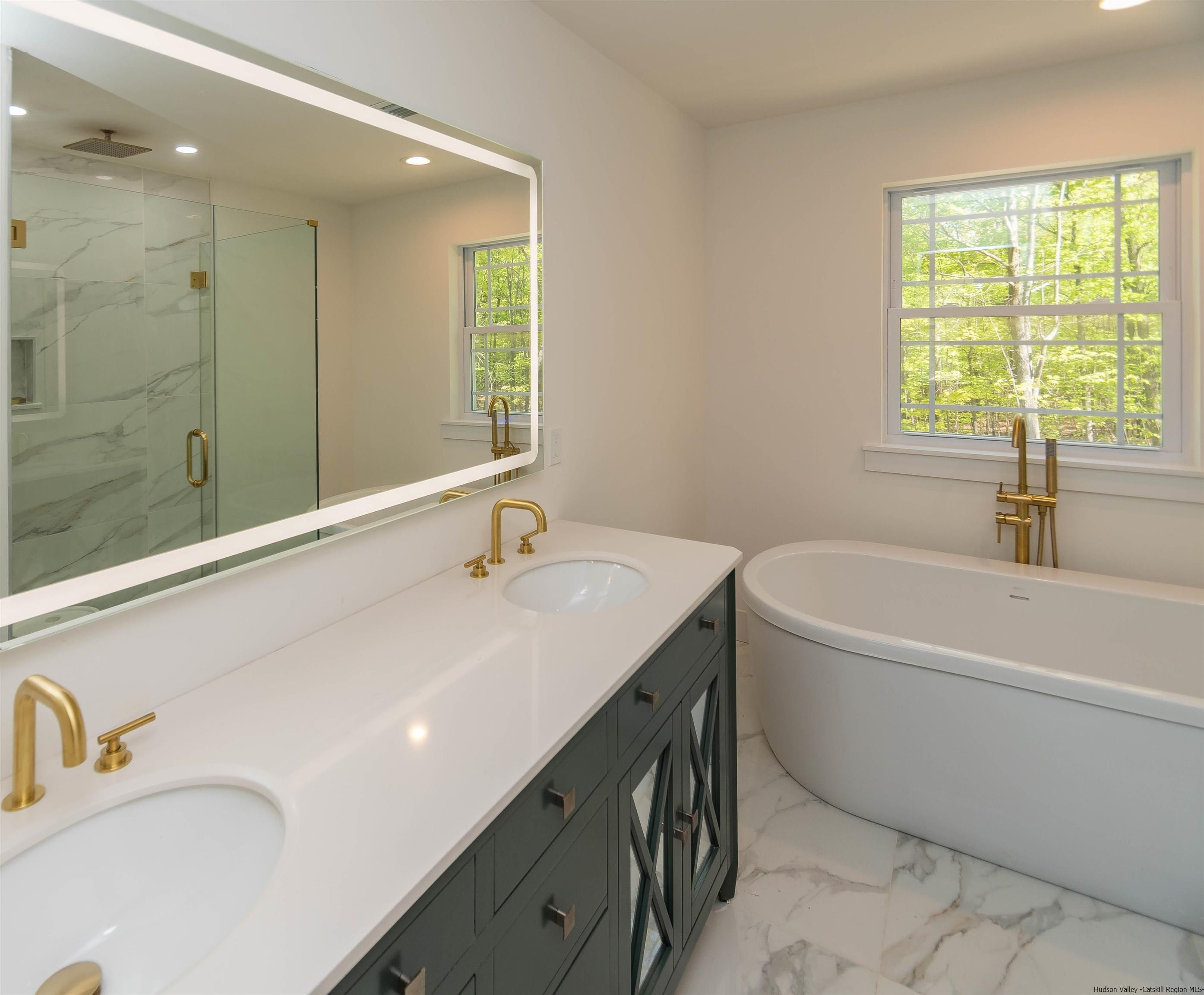 5 Calico Ways Ways, Unit WAYS Wallkill, NY 12589 - Photo 24 of 35 a bathroom with a tub sink and mirror