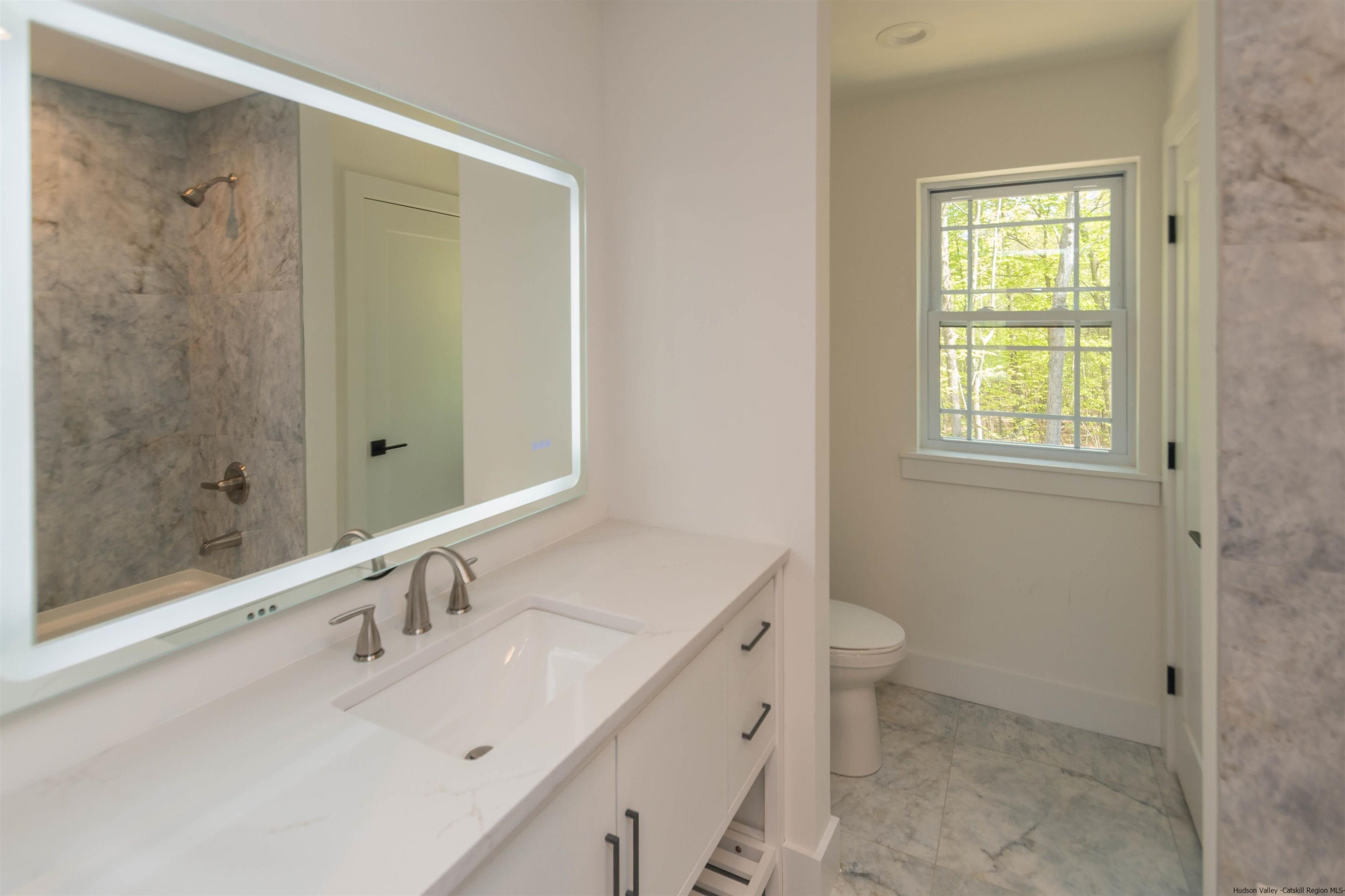 5 Calico Ways Ways, Unit WAYS Wallkill, NY 12589 - Photo 29 of 35 a bathroom with a sink toilet and shower