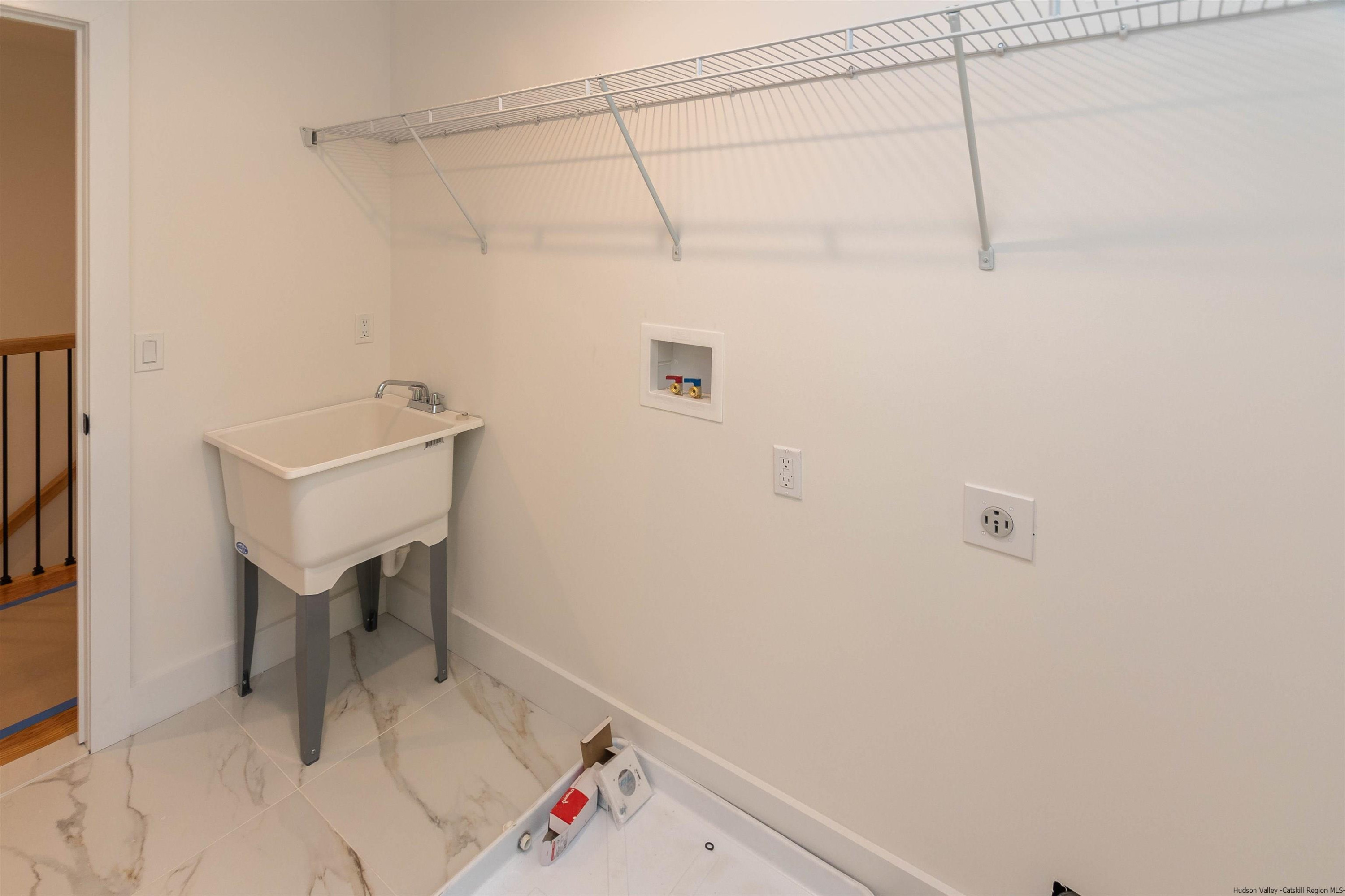 5 Calico Ways Ways, Unit WAYS Wallkill, NY 12589 - Photo 32 of 35 a bathroom with a sink and a table