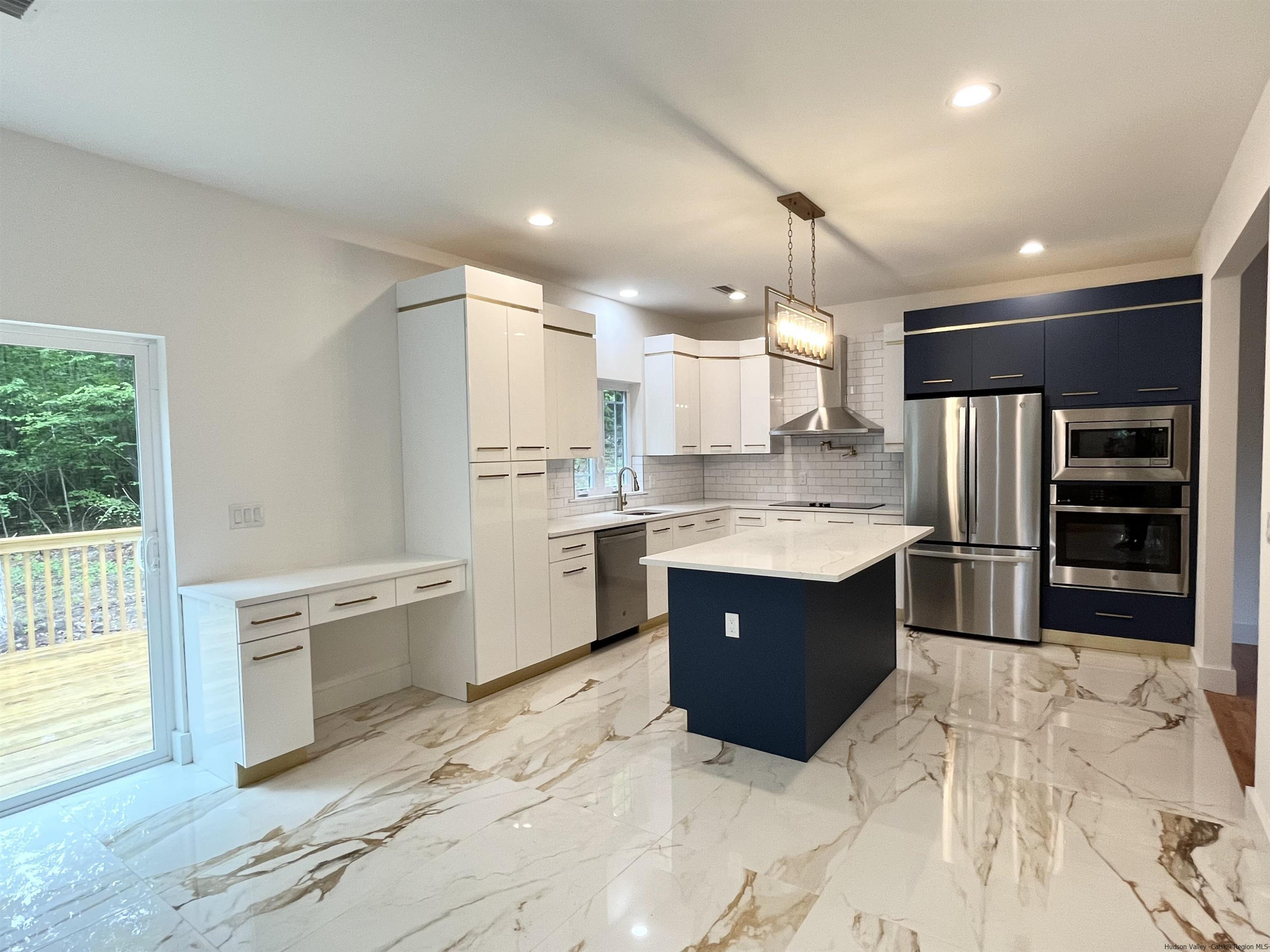 5 Calico Ways Ways, Unit WAYS Wallkill, NY 12589 - Photo 7 of 35 a large kitchen with kitchen island a sink stainless steel appliances and cabinets