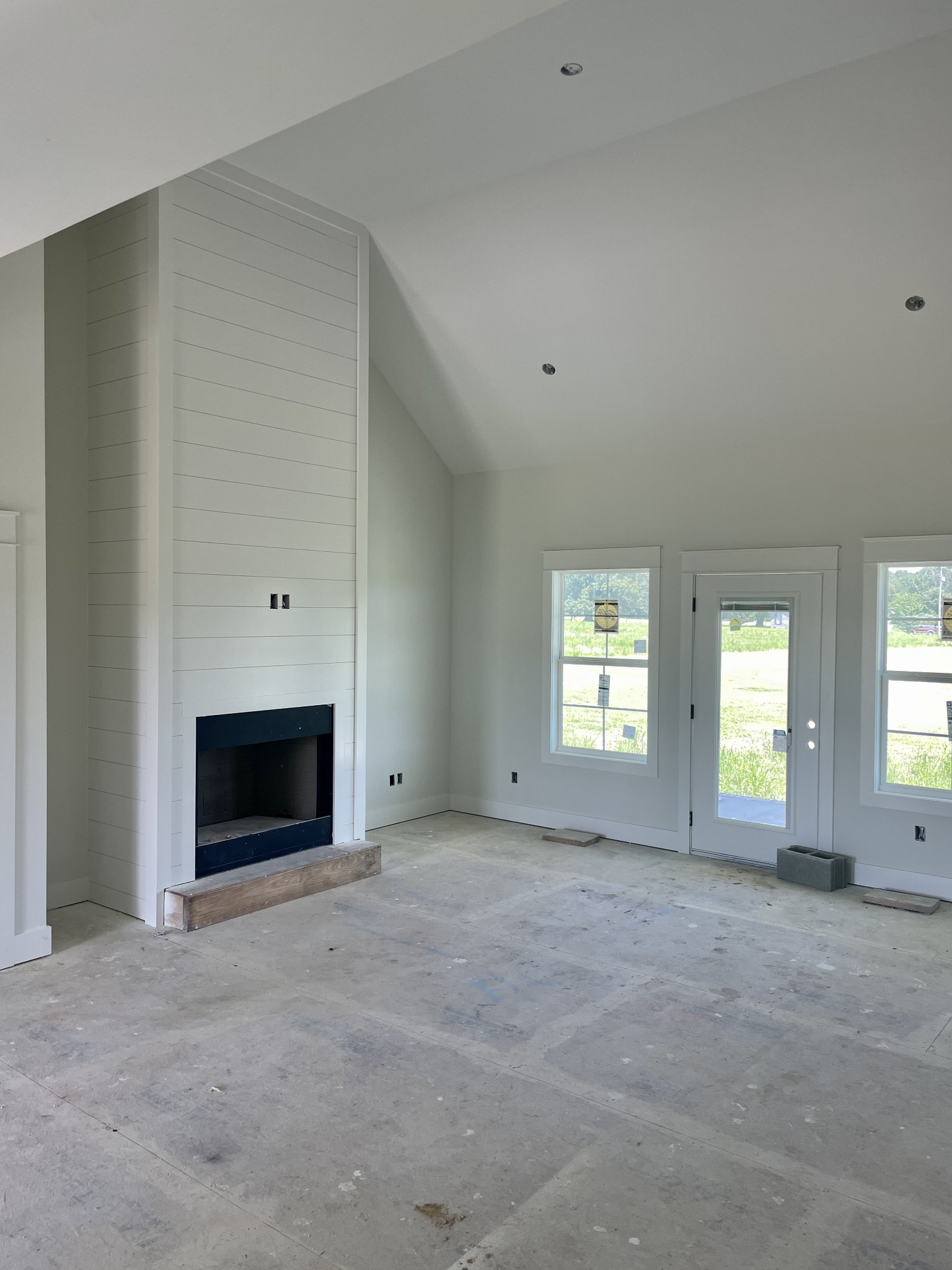 799 Jackson Road Portland, TN 37148 - Photo 3 of 3 an empty room with windows and fireplace