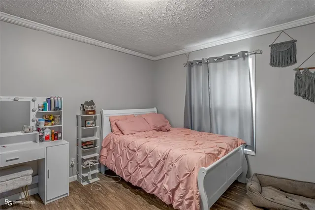 a bedroom with a bed and a closet