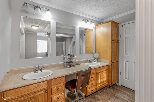 a bathroom with a double vanity sink and a mirror
