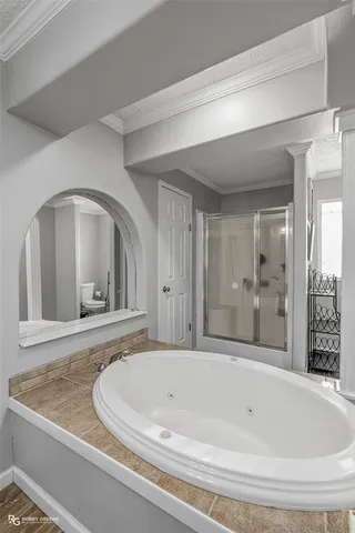 a bathroom with a bathtub and a sink