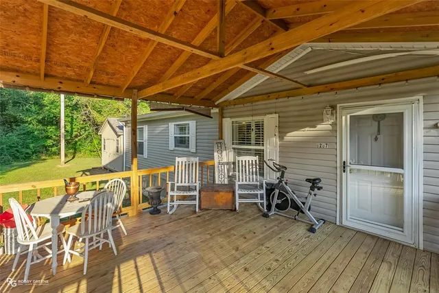 a view of a chairs and table in the patio