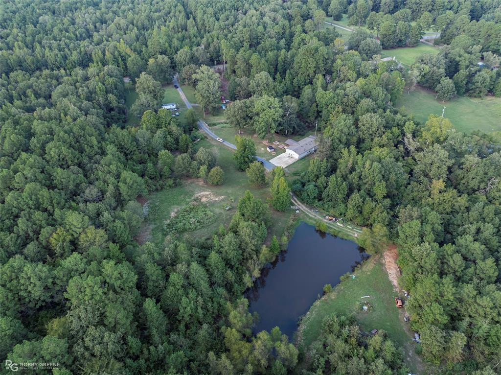 8287 Jefferson Paige Road Shreveport, LA 71119 - Photo 35 of 40 Aerial view of property and surrounding area with a forest and a nearby body of water
