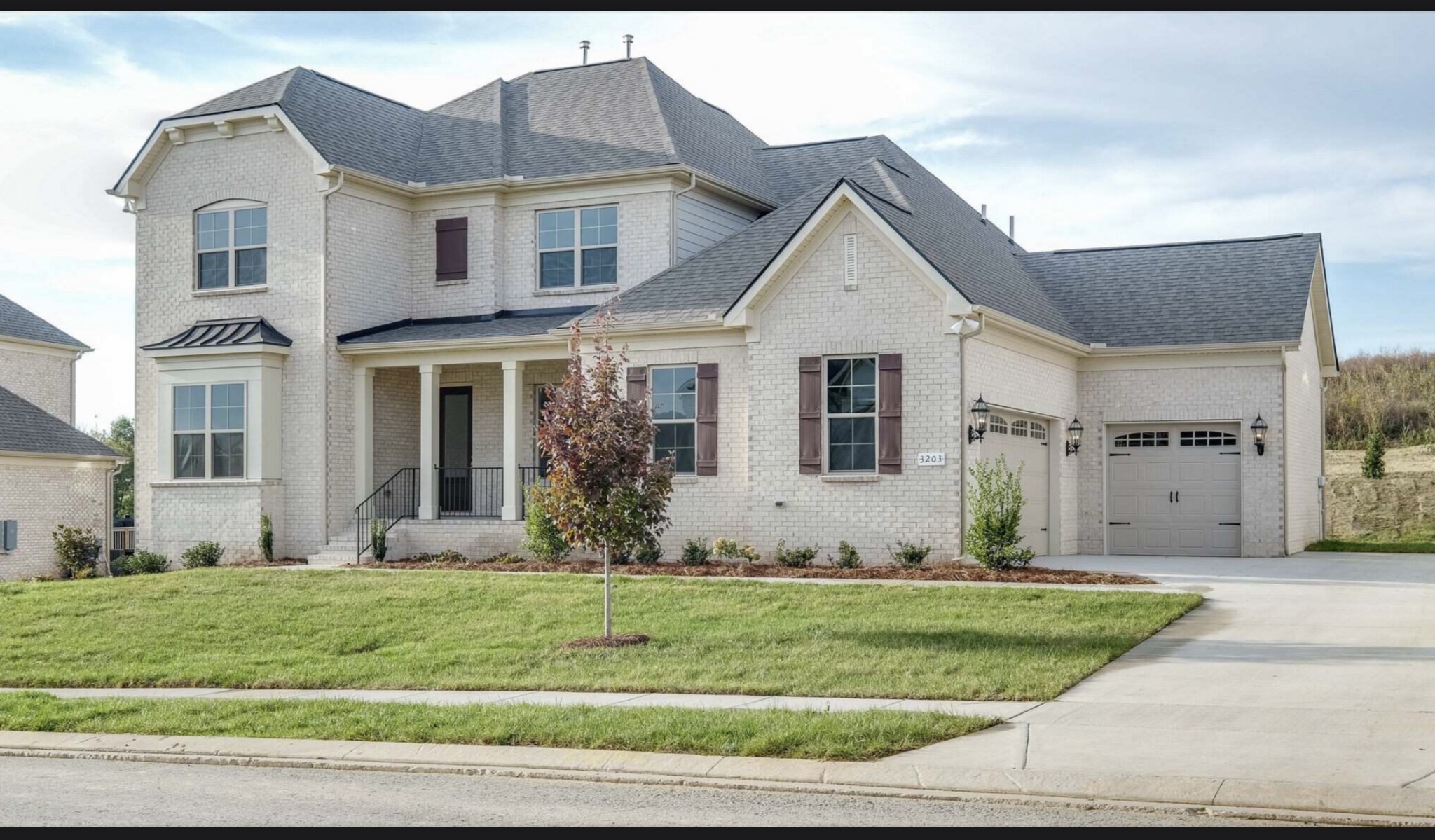 3203 Chase Point Drive Franklin, TN 37067 - Photo 2 of 30 a front view of a house with garden