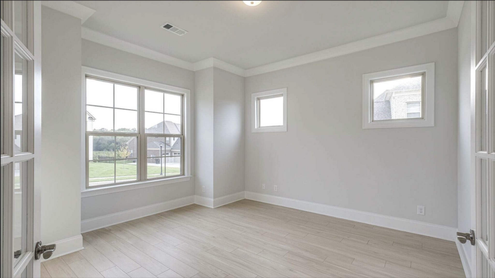 3203 Chase Point Drive Franklin, TN 37067 - Photo 6 of 30 an empty room with wooden floor and windows