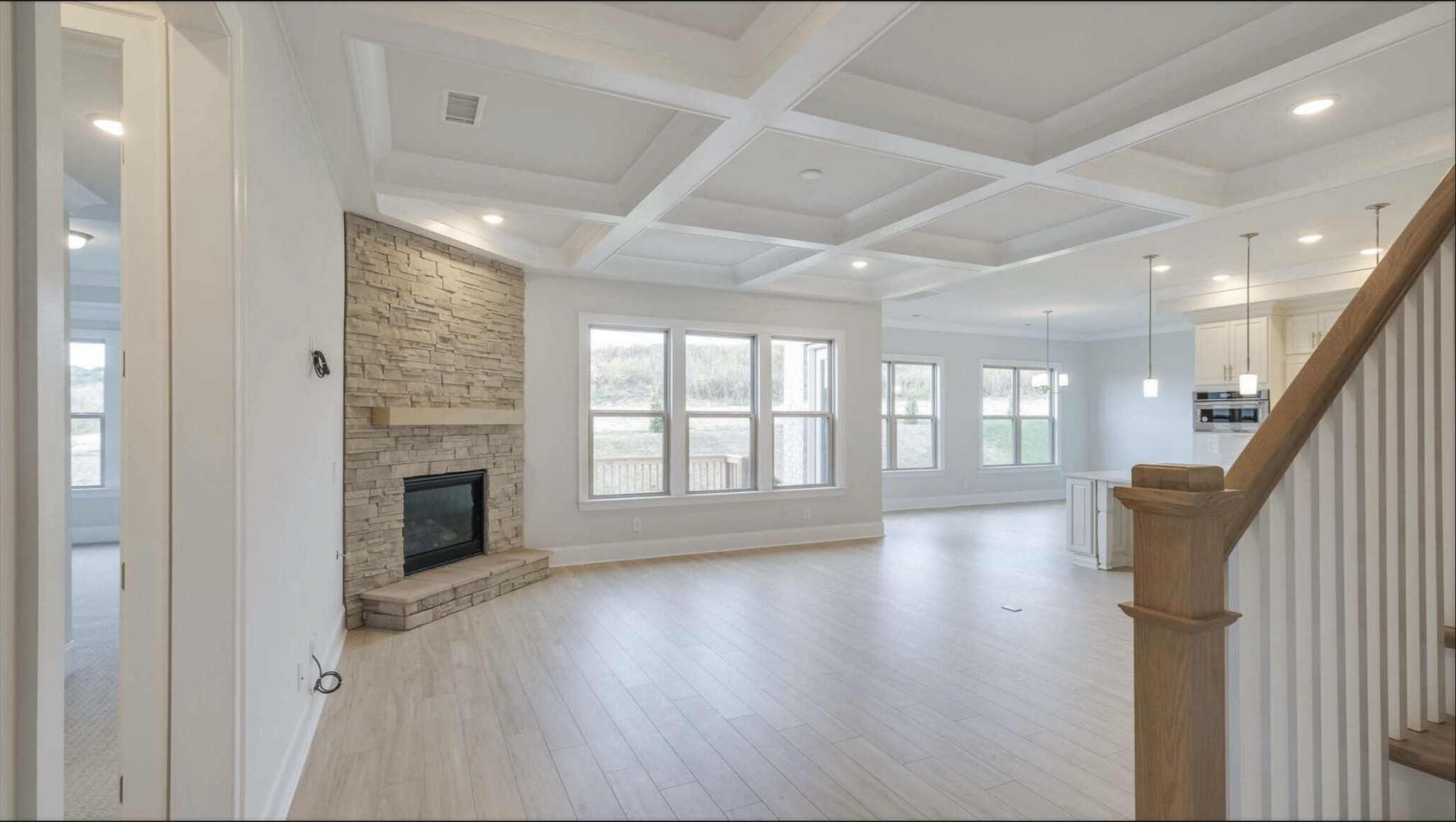 3203 Chase Point Drive Franklin, TN 37067 - Photo 7 of 30 a view of an empty room with wooden floor and a fireplace