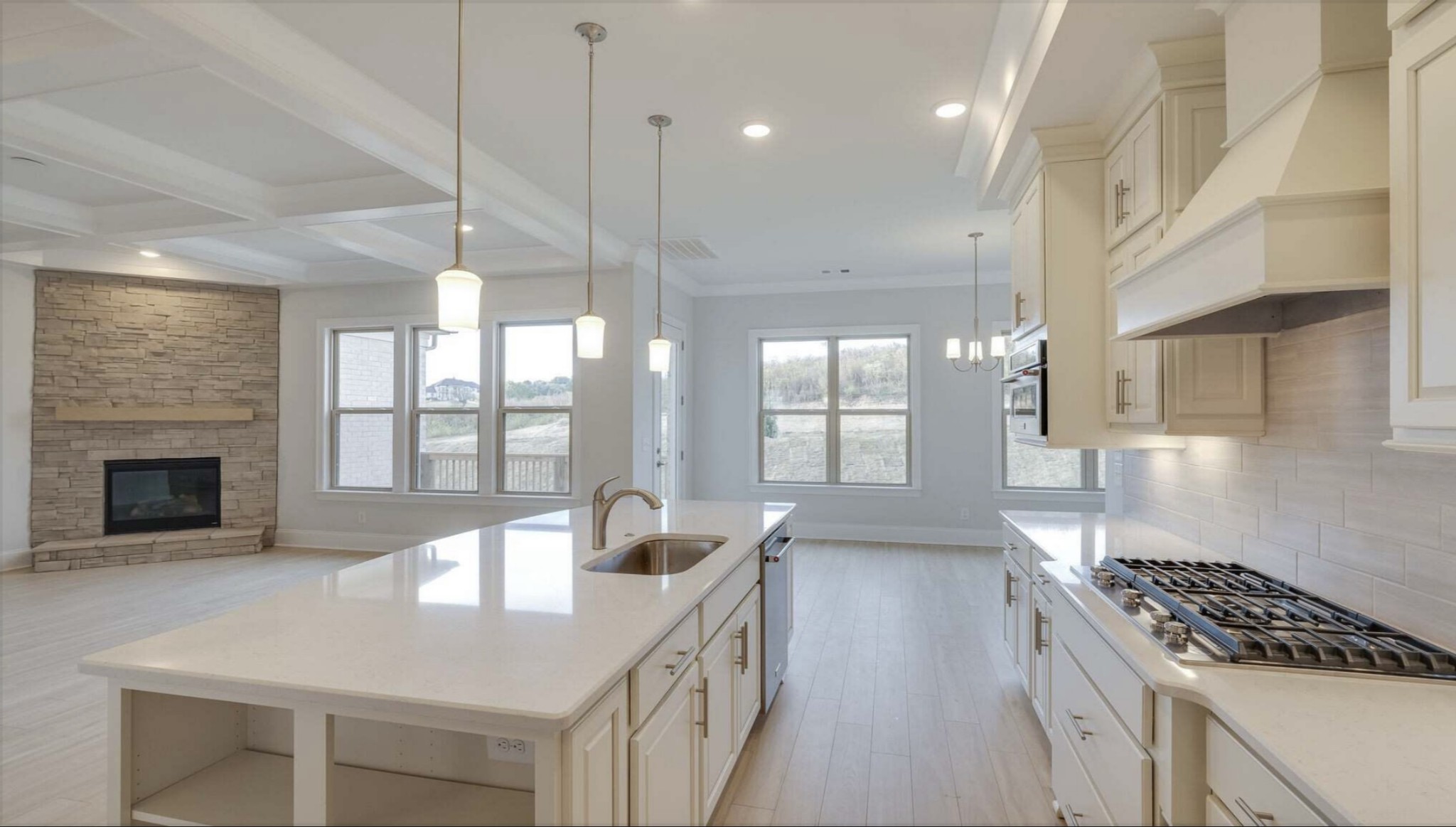 3203 Chase Point Drive Franklin, TN 37067 - Photo 10 of 30 a kitchen with stainless steel appliances granite countertop a stove a sink and a refrigerator
