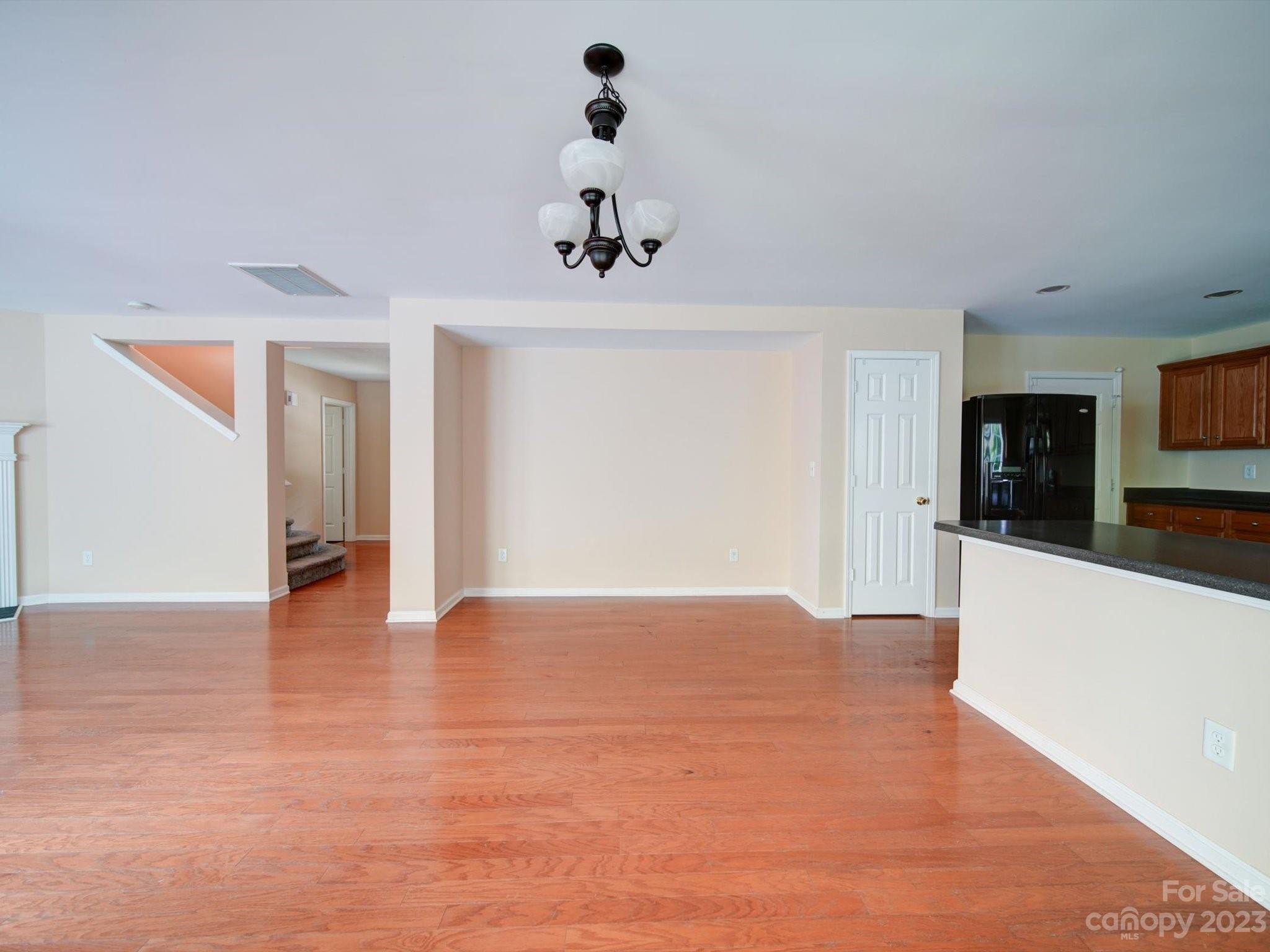 9221 Seamill Road Charlotte, NC 28278 - Photo 13 of 38 a view of an empty room with window and a kitchen