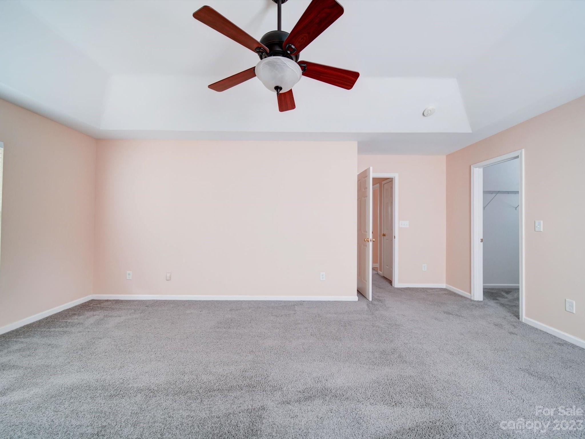 9221 Seamill Road Charlotte, NC 28278 - Photo 21 of 38 an empty room with ceiling fan and window