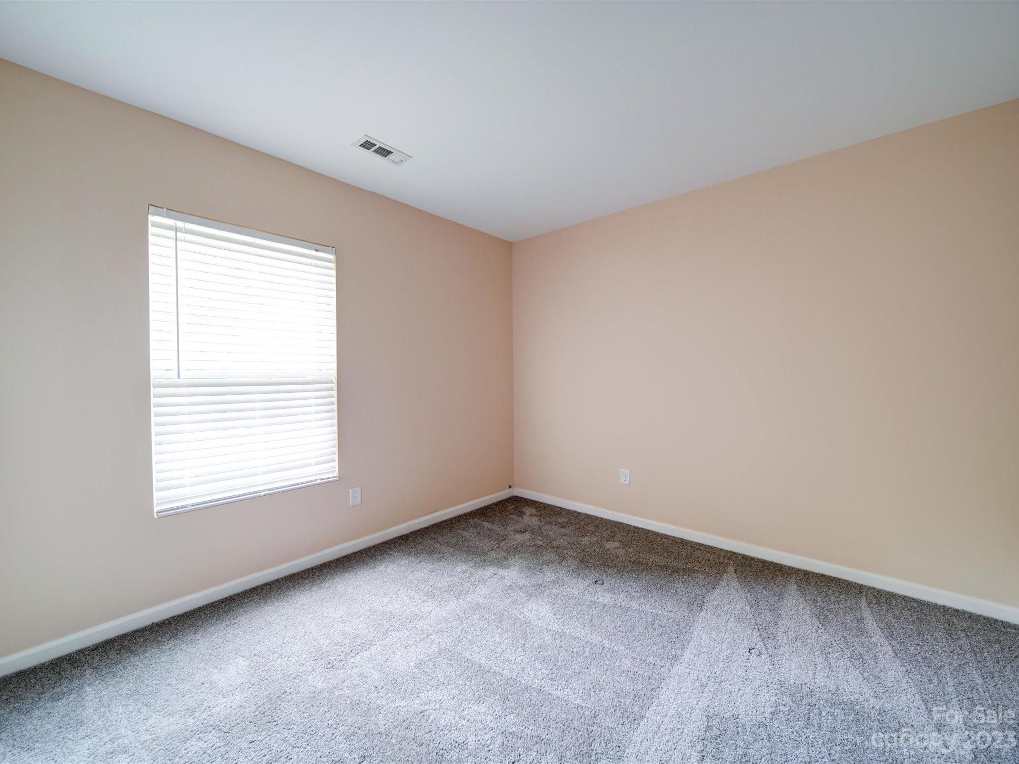9221 Seamill Road Charlotte, NC 28278 - Photo 25 of 38 an empty room with a window