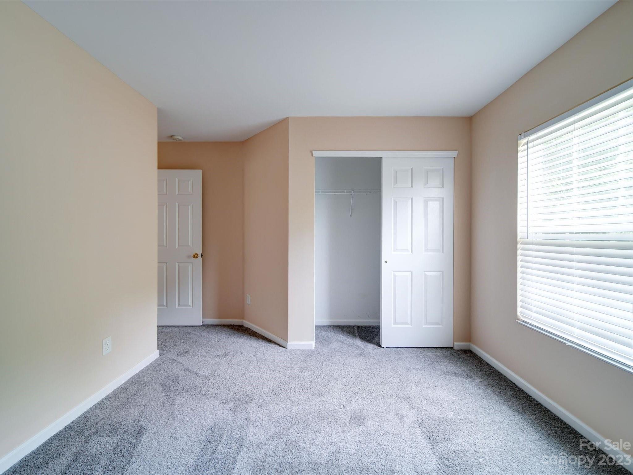9221 Seamill Road Charlotte, NC 28278 - Photo 27 of 38 a view of an empty room with a window