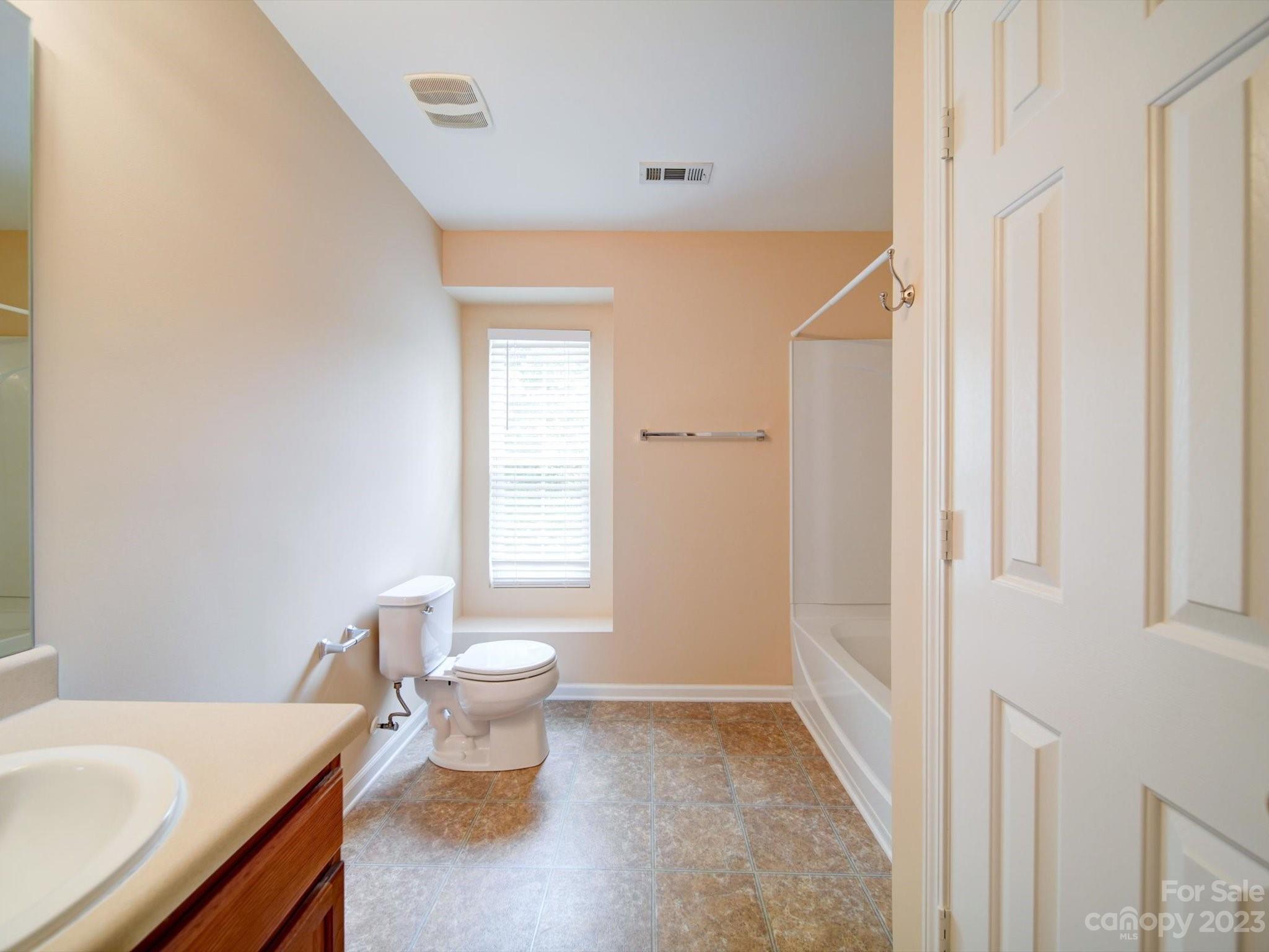 9221 Seamill Road Charlotte, NC 28278 - Photo 31 of 38 a bathroom with a sink and a toilet