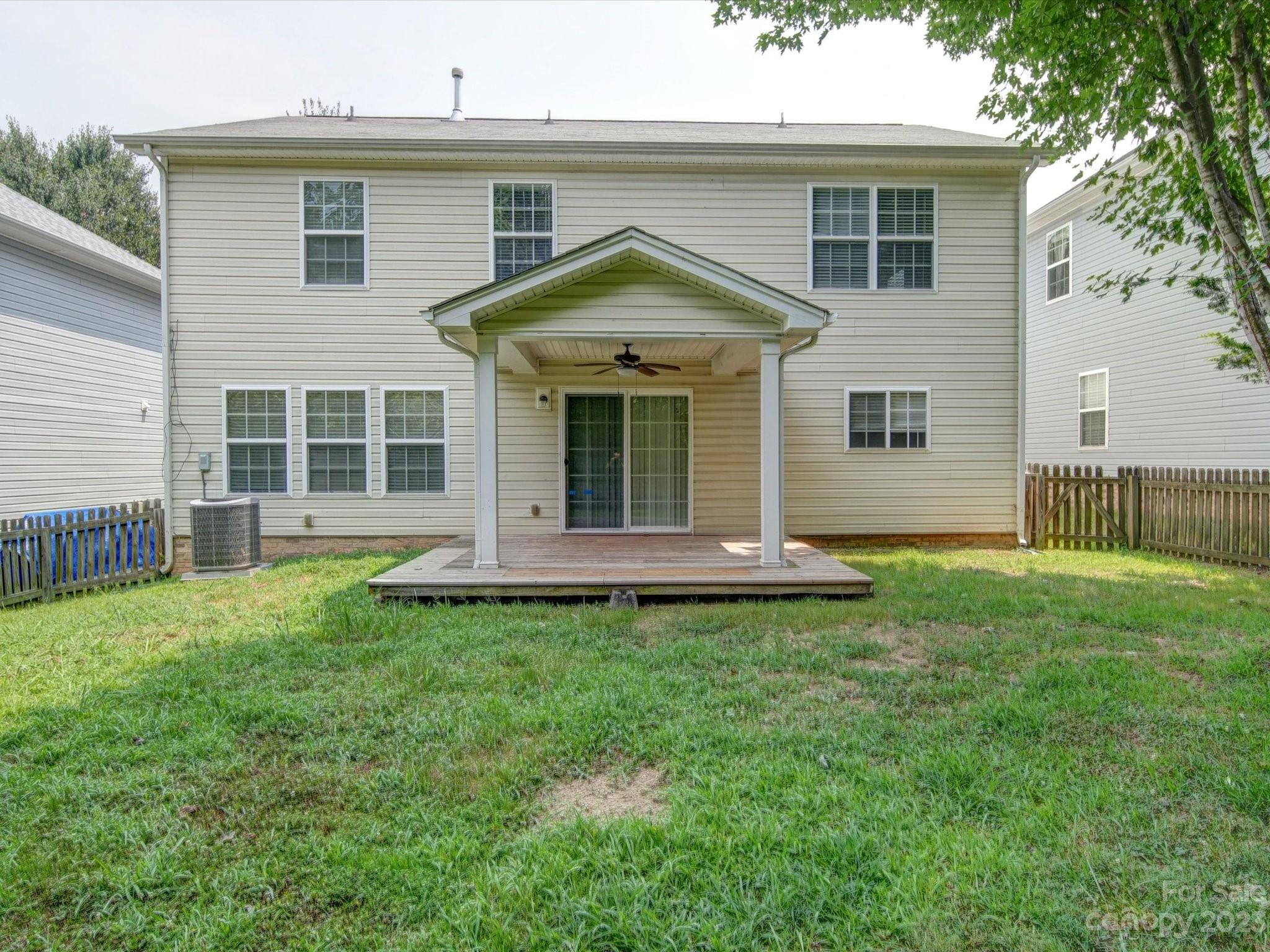 9221 Seamill Road Charlotte, NC 28278 - Photo 35 of 38 a view of a house with a yard and sitting area