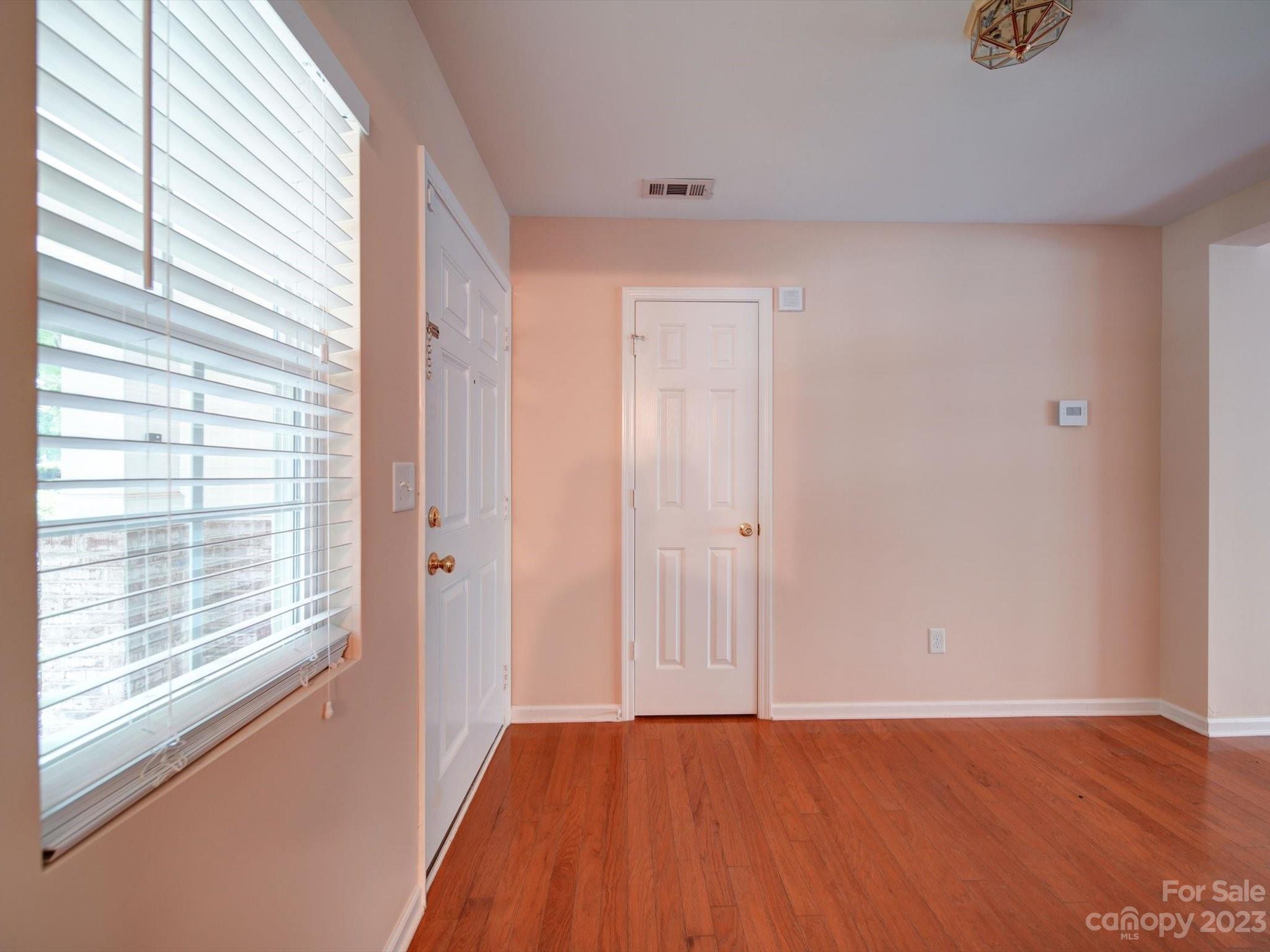 9221 Seamill Road Charlotte, NC 28278 - Photo 5 of 38 a view of an empty room with a window