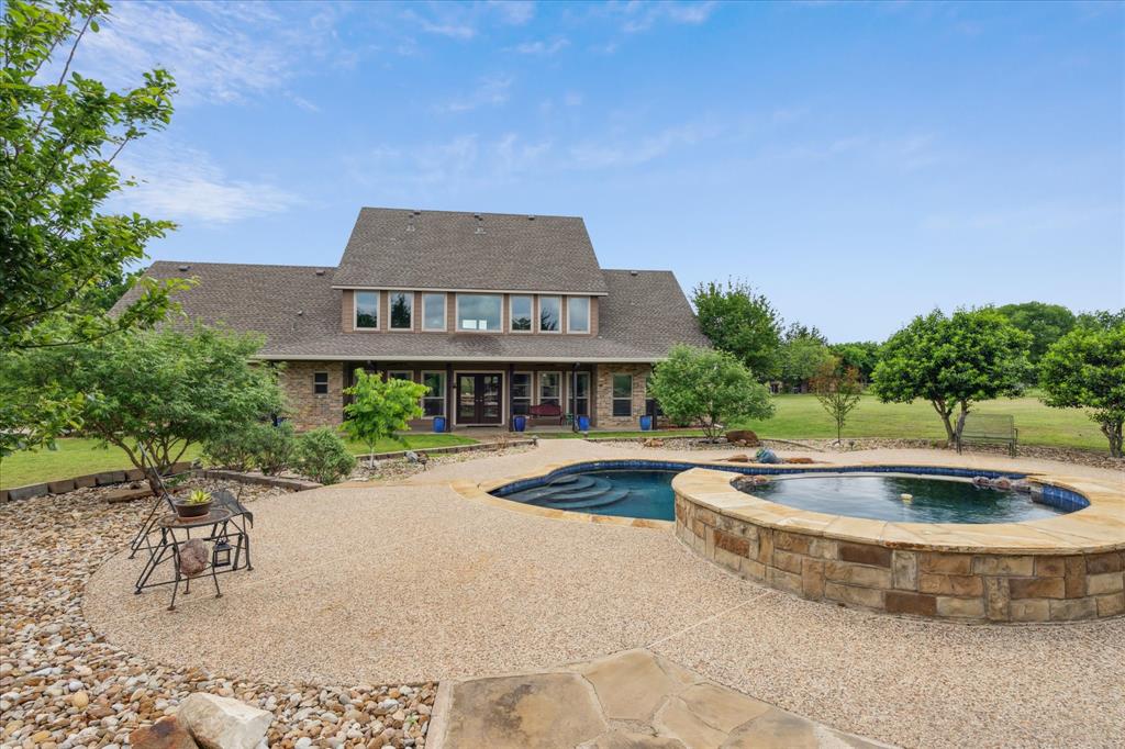6251 Hayes Road Midlothian, TX 76065 - Photo 4 of 30 a view of a house with swimming pool and a yard