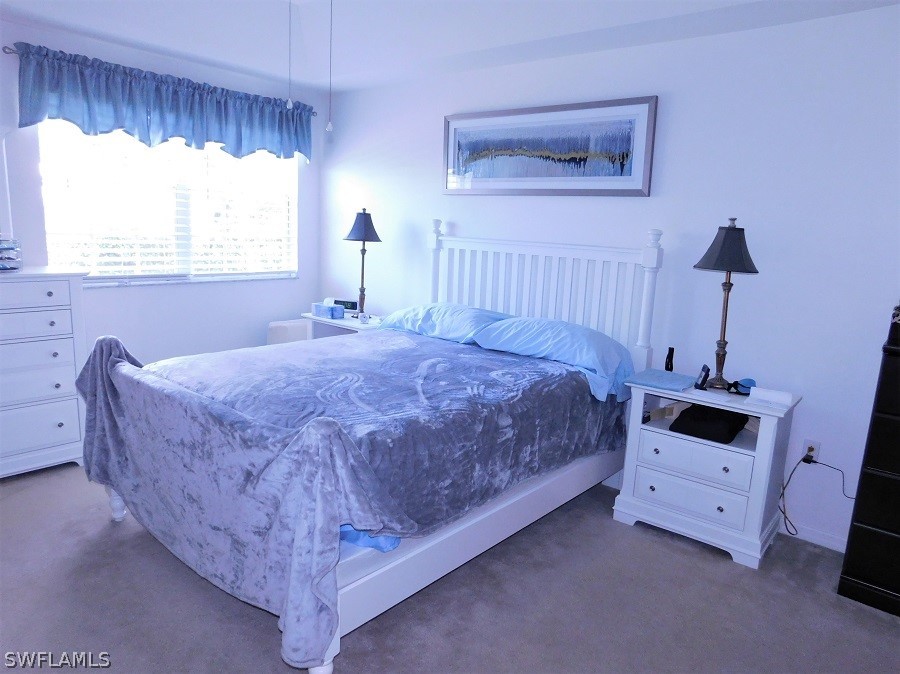 5180 Park Road, Unit 1 Fort Myers, FL 33908 - Photo 13 of 24 a bedroom with a bed and a window