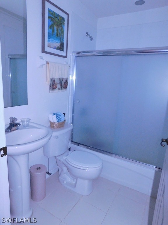 5180 Park Road, Unit 1 Fort Myers, FL 33908 - Photo 17 of 24 a white toilet sitting next to a bathroom sink