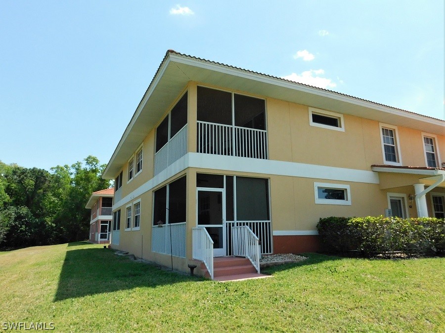 5180 Park Road, Unit 1 Fort Myers, FL 33908 - Photo 19 of 24 a front view of a house with a yard