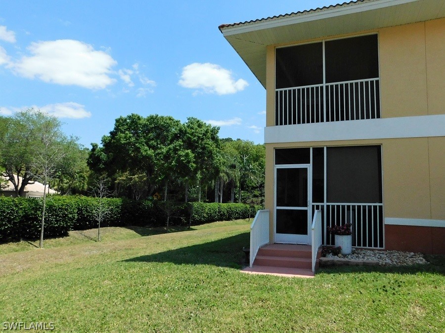 5180 Park Road, Unit 1 Fort Myers, FL 33908 - Photo 20 of 24 a view of a house with a yard and a porch