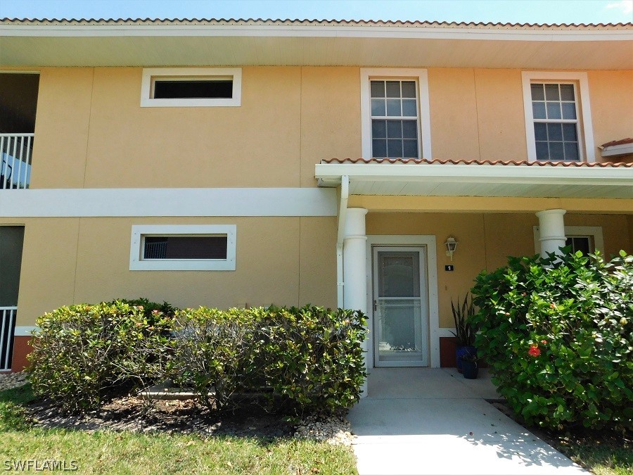 5180 Park Road, Unit 1 Fort Myers, FL 33908 - Photo 6 of 24 a front view of a house with a yard