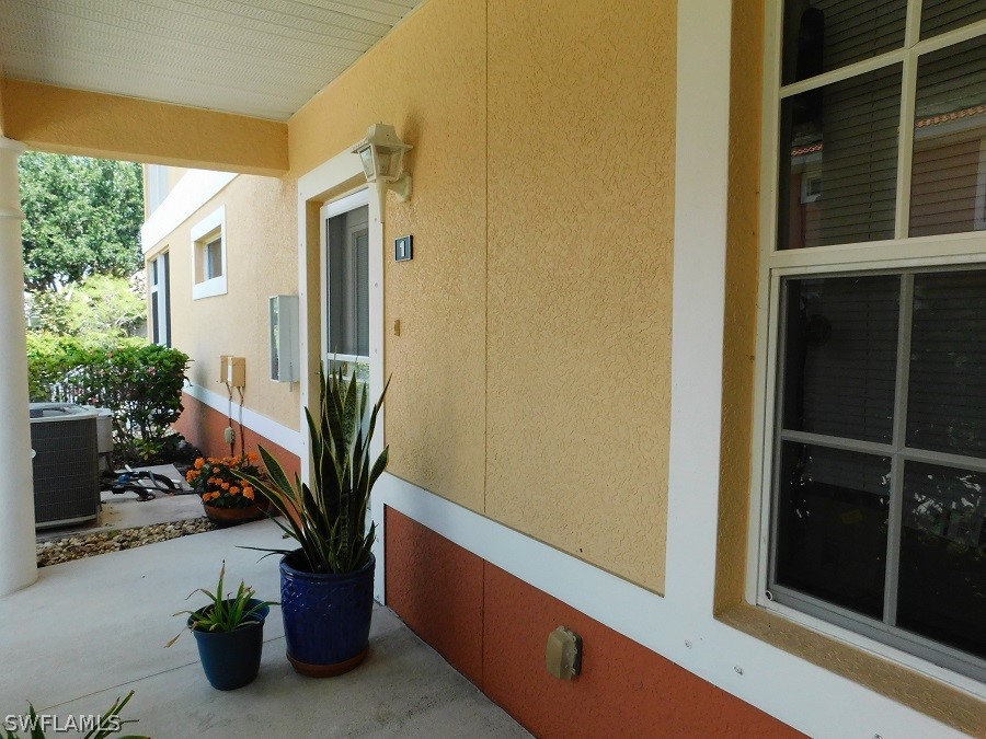 5180 Park Road, Unit 1 Fort Myers, FL 33908 - Photo 7 of 24 a potted plant sitting in front of a glass door