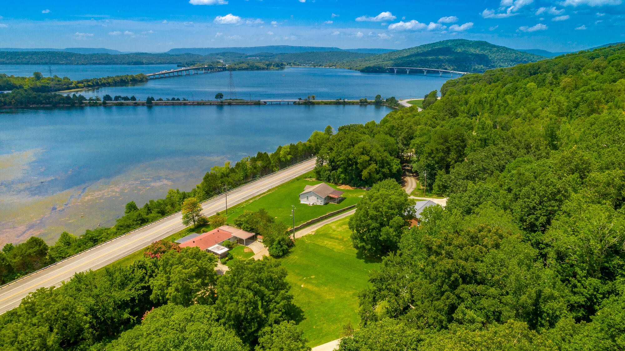 0 Highway 134 Guild, TN 37340 - Photo 8 of 68 a view of a lake with a yard and mountain view