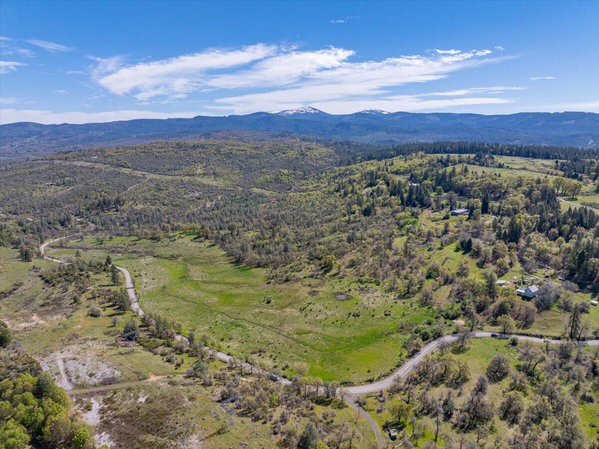 16483 Buzzard Roost Road Bella Vista, CA 96008 - Photo 104 of 138 a view of a lake with mountains in the background