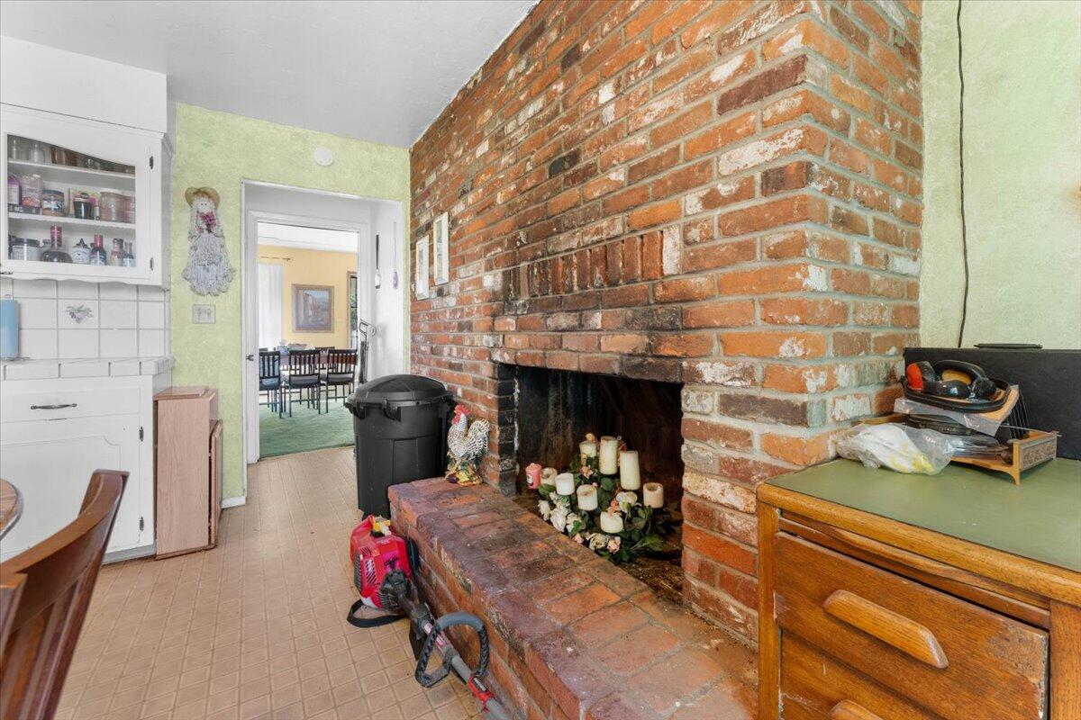 16483 Buzzard Roost Road Bella Vista, CA 96008 - Photo 131 of 138 a living room with furniture and a fireplace