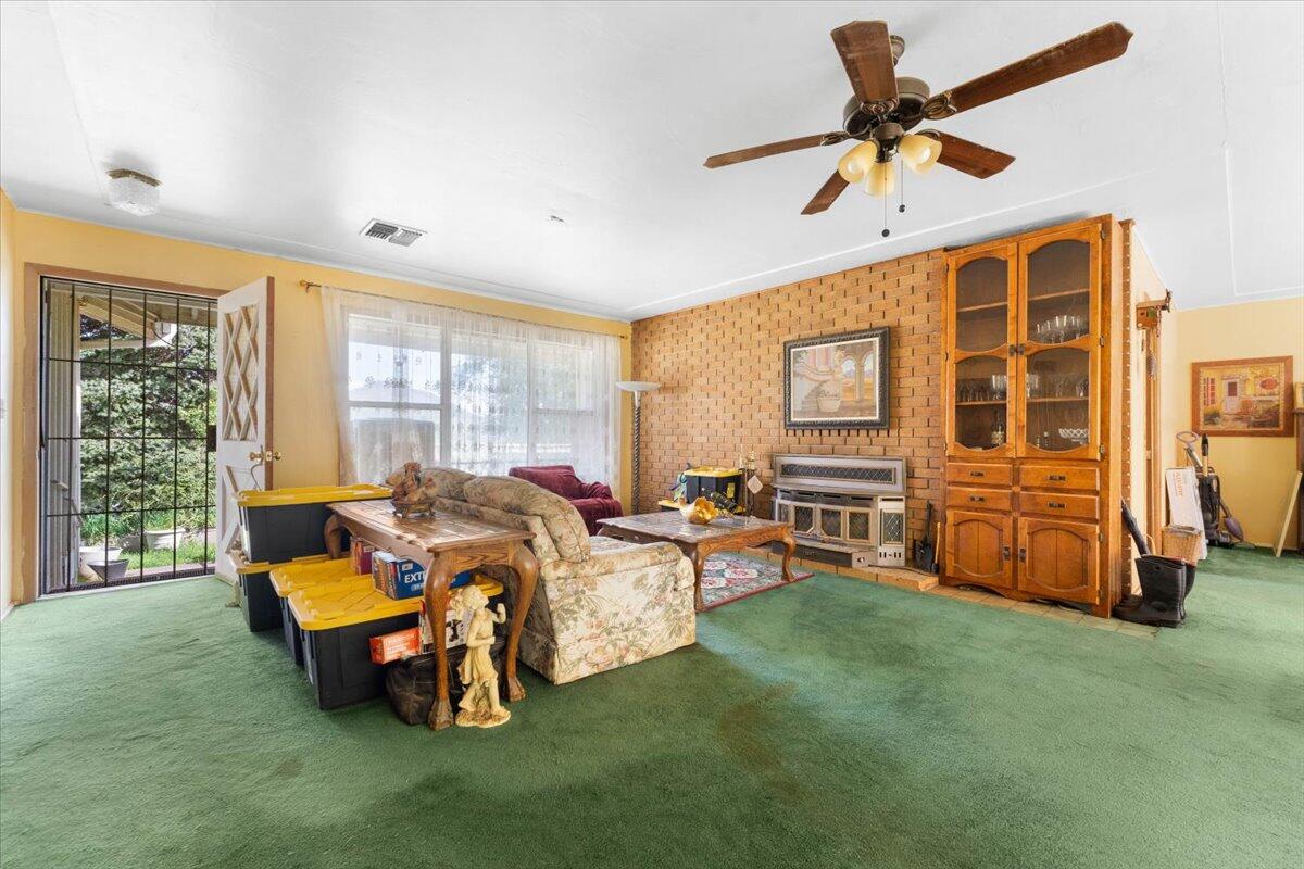 16483 Buzzard Roost Road Bella Vista, CA 96008 - Photo 135 of 138 a living room with furniture and a ceiling fan