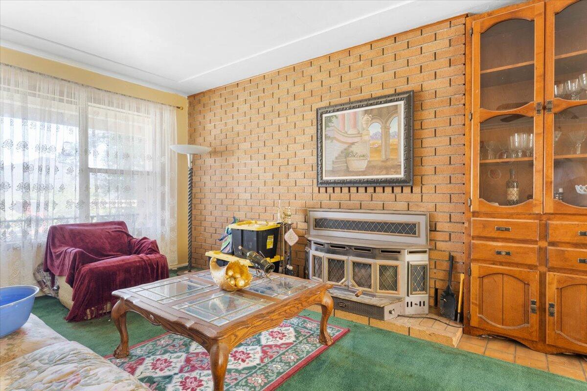 16483 Buzzard Roost Road Bella Vista, CA 96008 - Photo 136 of 138 a living room with furniture a rug and a window