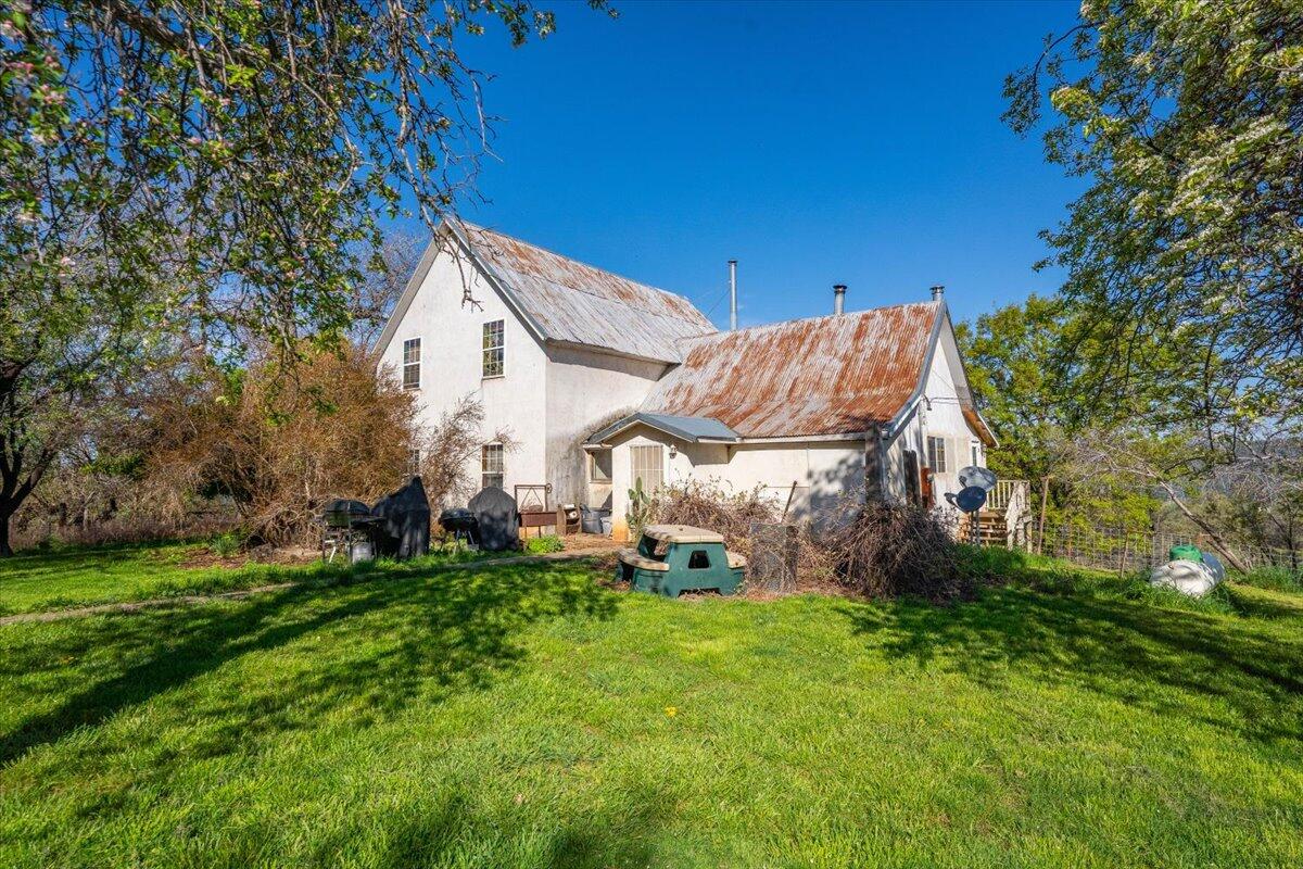 16483 Buzzard Roost Road Bella Vista, CA 96008 - Photo 17 of 138 a view of a house with a big yard and large trees