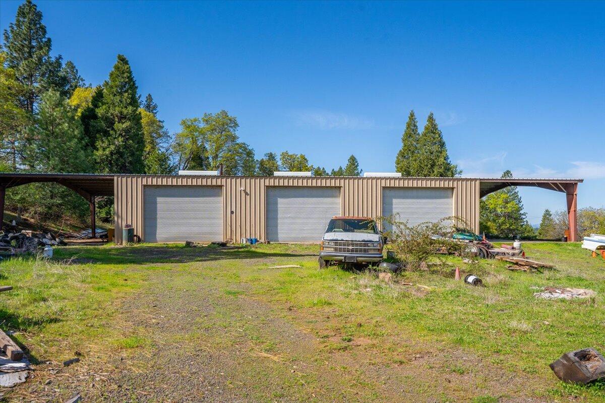16483 Buzzard Roost Road Bella Vista, CA 96008 - Photo 32 of 138 a view of a patio with table and chairs and potted plants