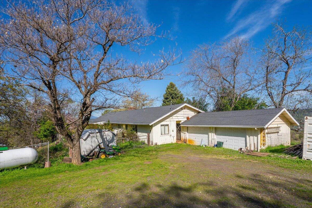 16483 Buzzard Roost Road Bella Vista, CA 96008 - Photo 5 of 138 a front view of a house with a yard