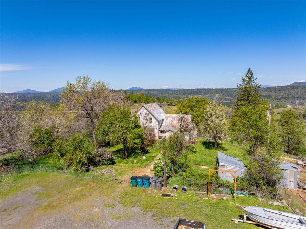 16483 Buzzard Roost Road Bella Vista, CA 96008 - Photo 92 of 138 an aerial view of residential houses with outdoor space and trees