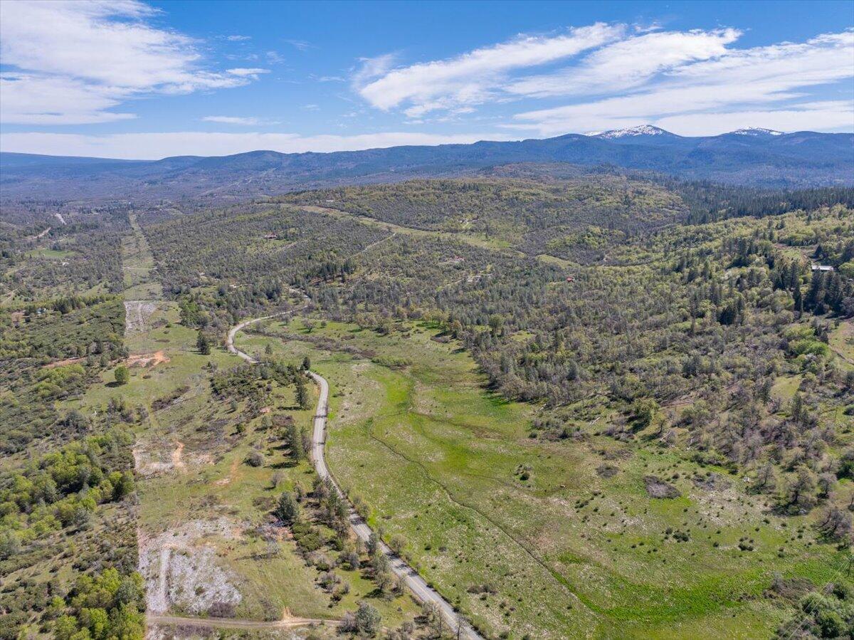 16483 Buzzard Roost Road Bella Vista, CA 96008 - Photo 99 of 138 a view of a city with mountains in the background