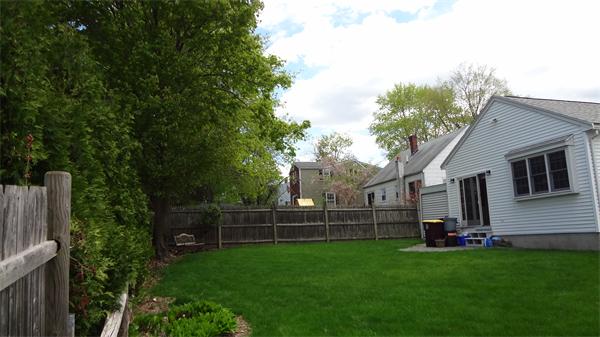 16 Brae Road Weymouth, MA 02191 - Photo 20 of 22 a view of a backyard with plants and a garden