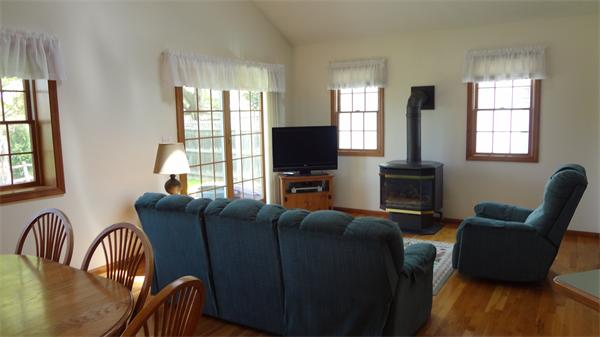 16 Brae Road Weymouth, MA 02191 - Photo 5 of 22 a living room with furniture a flat screen tv and windows
