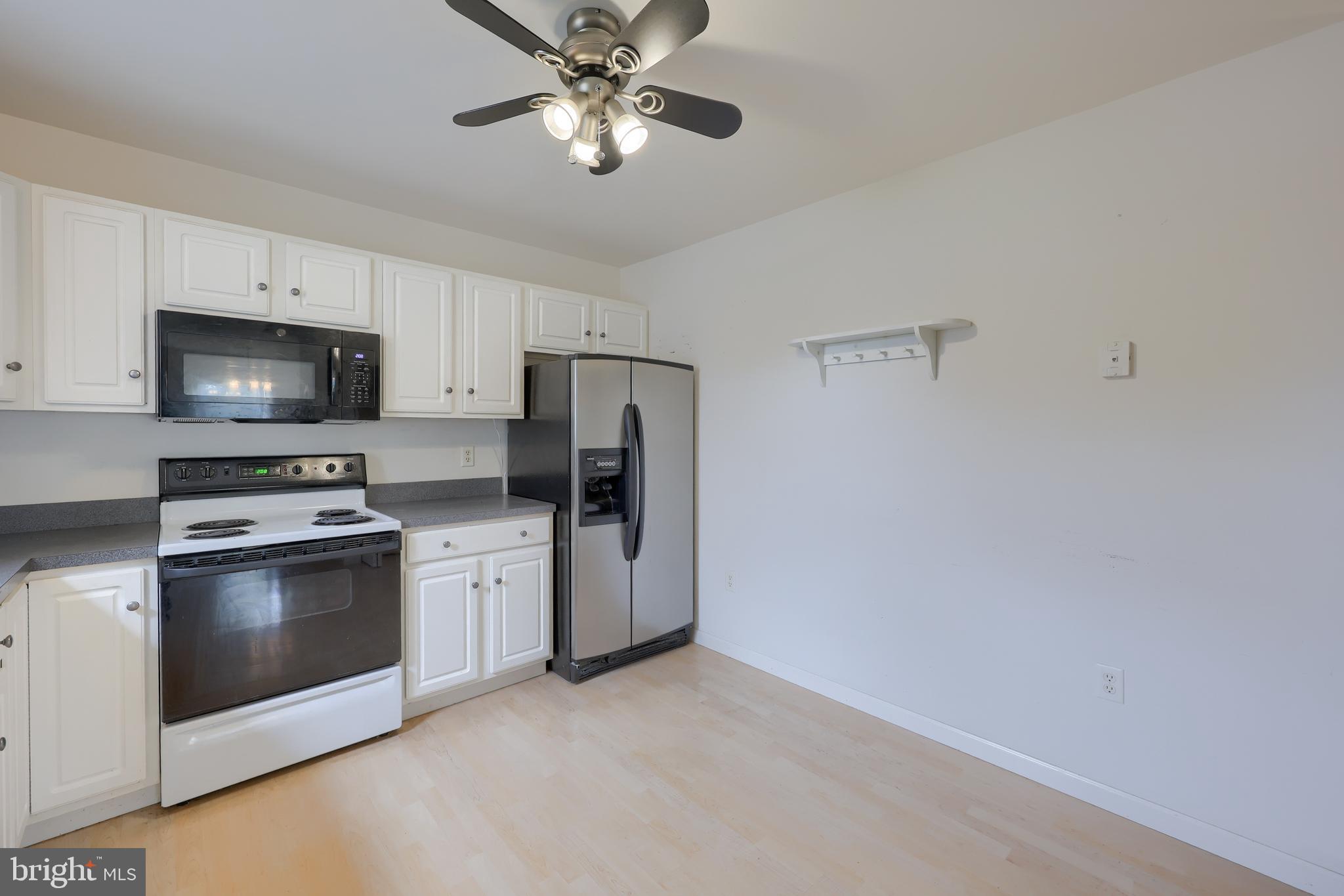 43 Sandstone Court Lititz, PA 17543 - Photo 6 of 50 a kitchen with stainless steel appliances a stove microwave and refrigerator