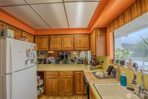 a kitchen with a sink and a window