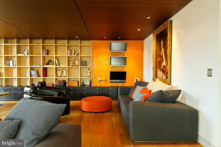 3303 Water Street Northwest, Unit 7AN Washington, DC 20007 - Photo 11 of 30 a living room with furniture and a floor to ceiling window