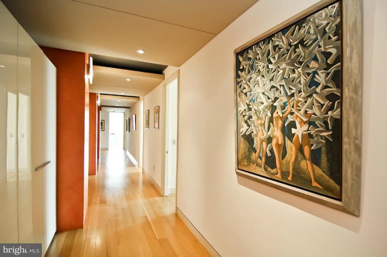 3303 Water Street Northwest, Unit 7AN Washington, DC 20007 - Photo 16 of 30 a view of a hallway with wooden floor and a bathroom