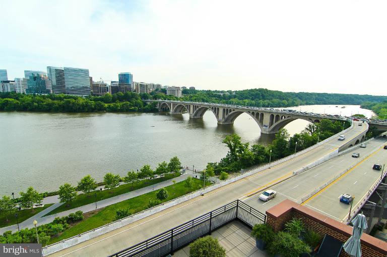 3303 Water Street Northwest, Unit 7AN Washington, DC 20007 - Photo 20 of 30 a view of a lake with a city view