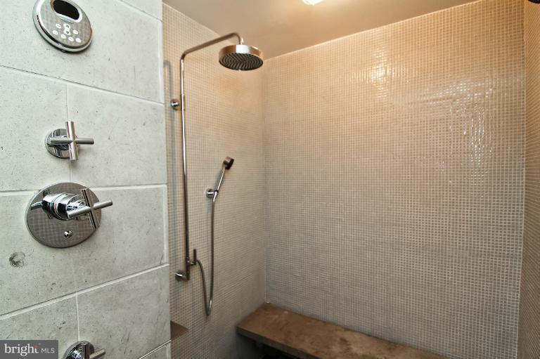 3303 Water Street Northwest, Unit 7AN Washington, DC 20007 - Photo 28 of 30 a bathroom with a shower and a sink