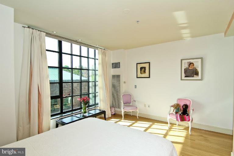 3303 Water Street Northwest, Unit 7AN Washington, DC 20007 - Photo 4 of 30 a bedroom with a bed and a window