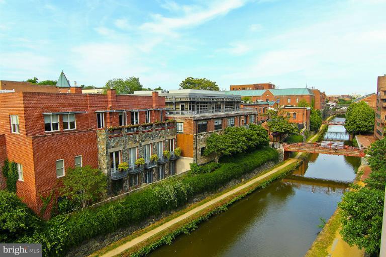 3303 Water Street Northwest, Unit 7AN Washington, DC 20007 - Photo 5 of 30 a view of residential houses with outdoor space and lake view