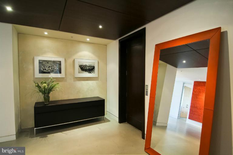 3303 Water Street Northwest, Unit 7AN Washington, DC 20007 - Photo 6 of 30 a room with furniture and wooden floor